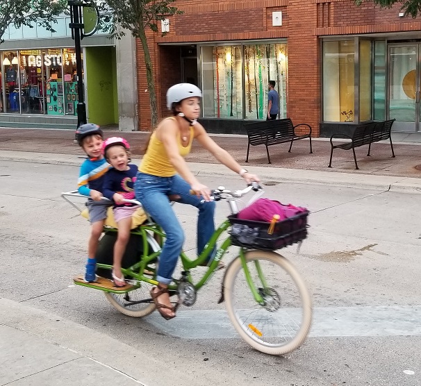 Biking on State Street with kids image