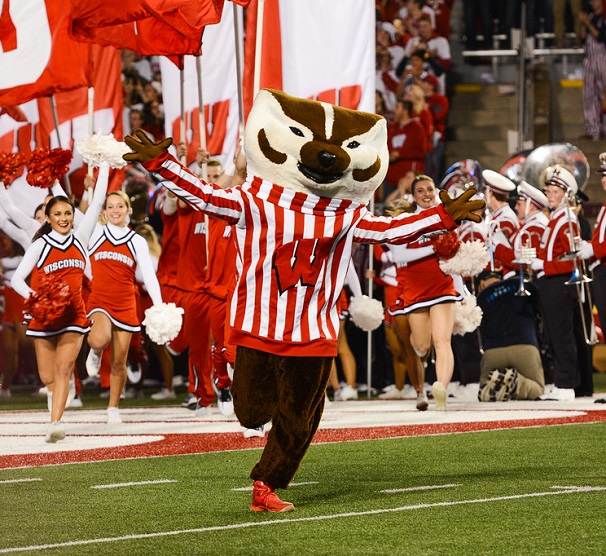 Bucky Badger running on football field