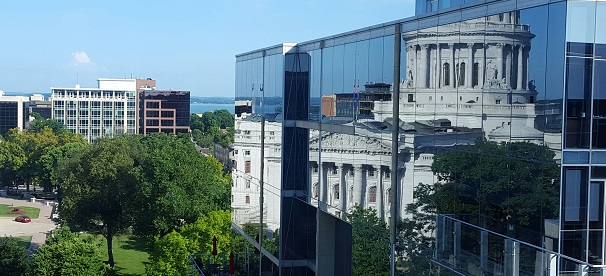 Capitol reflection on an office building