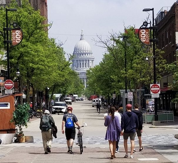 people walking down state street in Madison