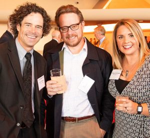 three people attending a business event