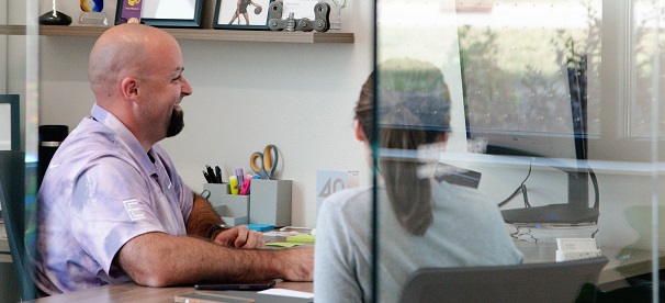 Event Essentials helping at a desk image